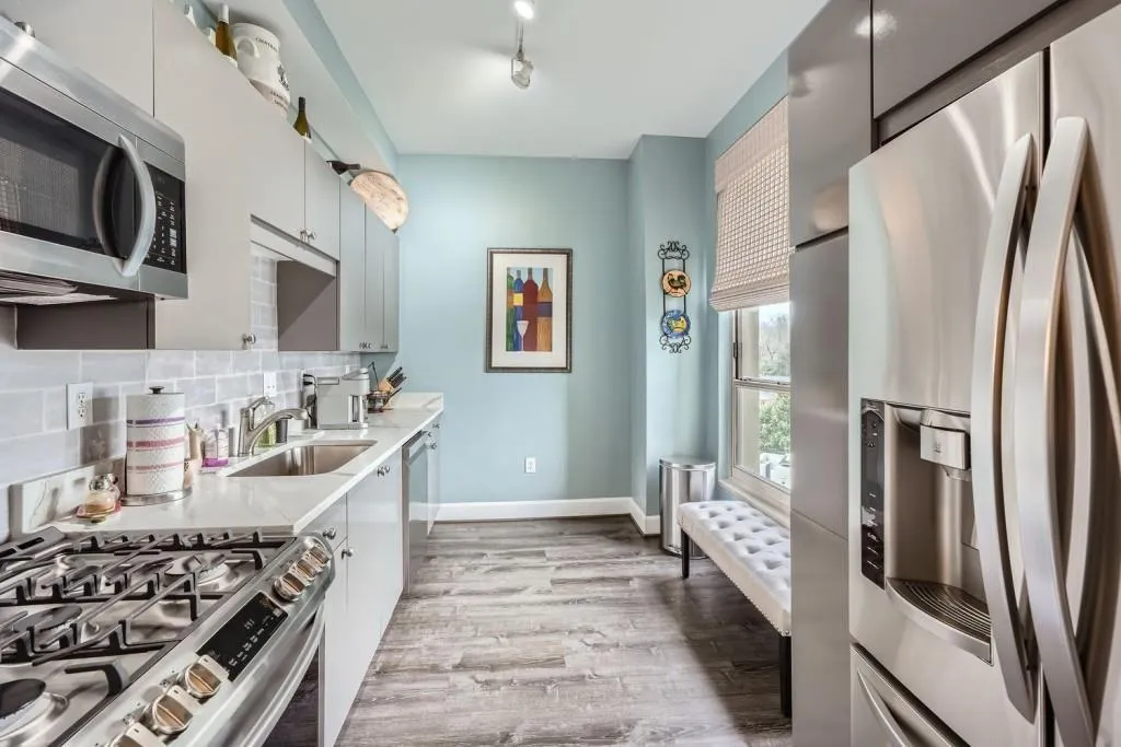 With new cabinet fronts, quartz counters,                  tiled back splash, new flooring and stainless appiances you' love making everything from coffee to filet mignon is this beautifully appointed kitchen.