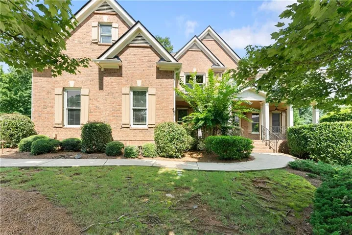 Brick exterior featuring multiple gables