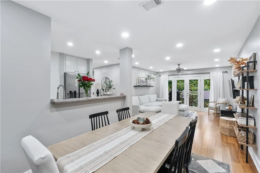 Dining area with recessed lighting, light wood-style flooring, french doors, and a ceiling fan