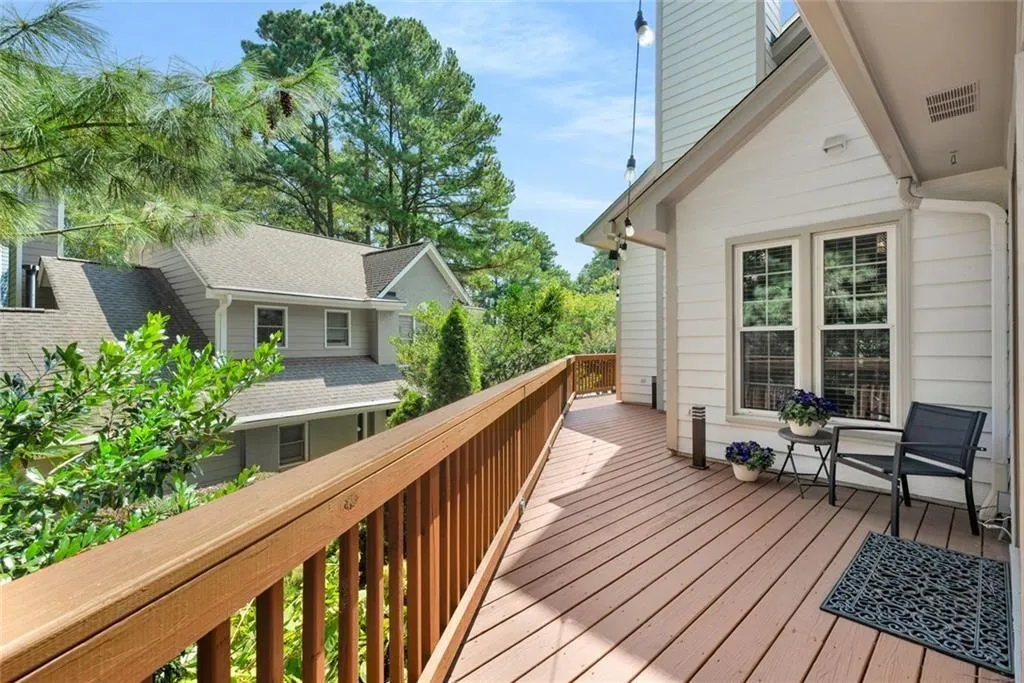 The deck wraps around the side of the house providing great outdoor space for seating and relaxation. Don't forget the grill too!