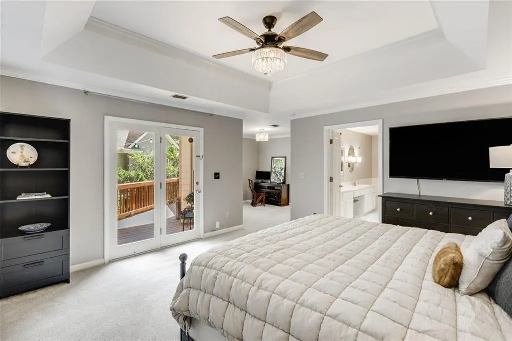 The primary bedroom allows access tot he deck with