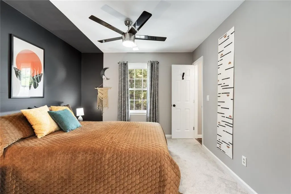 Secondary Bedroom upstairs with custom alcove paint finish is light filled too! There is a private half bath on -suite.
