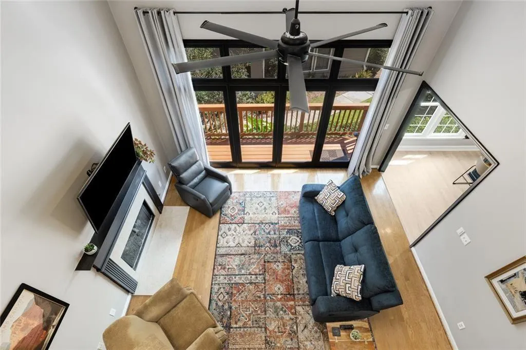 View from upstairs hallway overlooking the great room. So much natural light! Joyful!