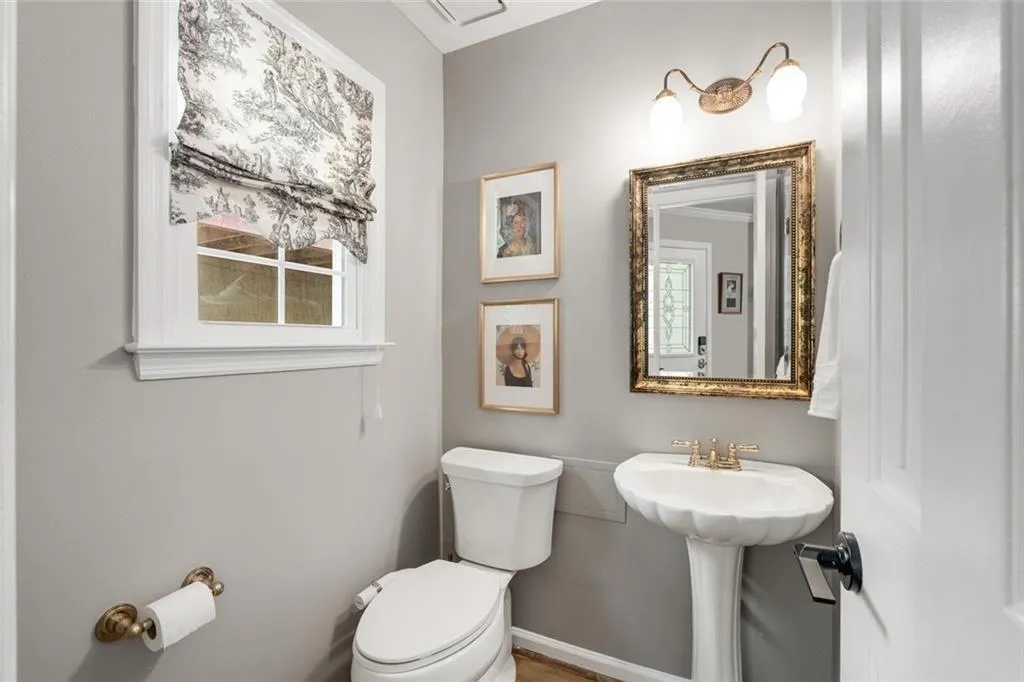 Powder Room is located just off the foyer entry.