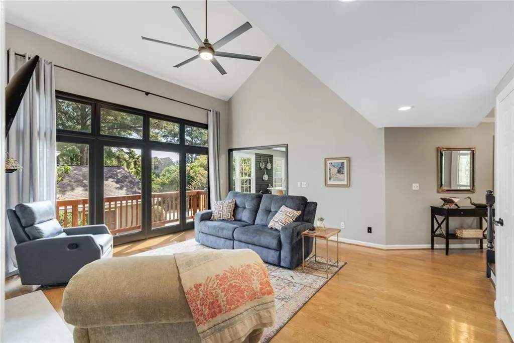 Hello sunshine! The wall of floor to ceiling windows bring the outside in! Custom lighting and ceiling fan moves the air and spirit!