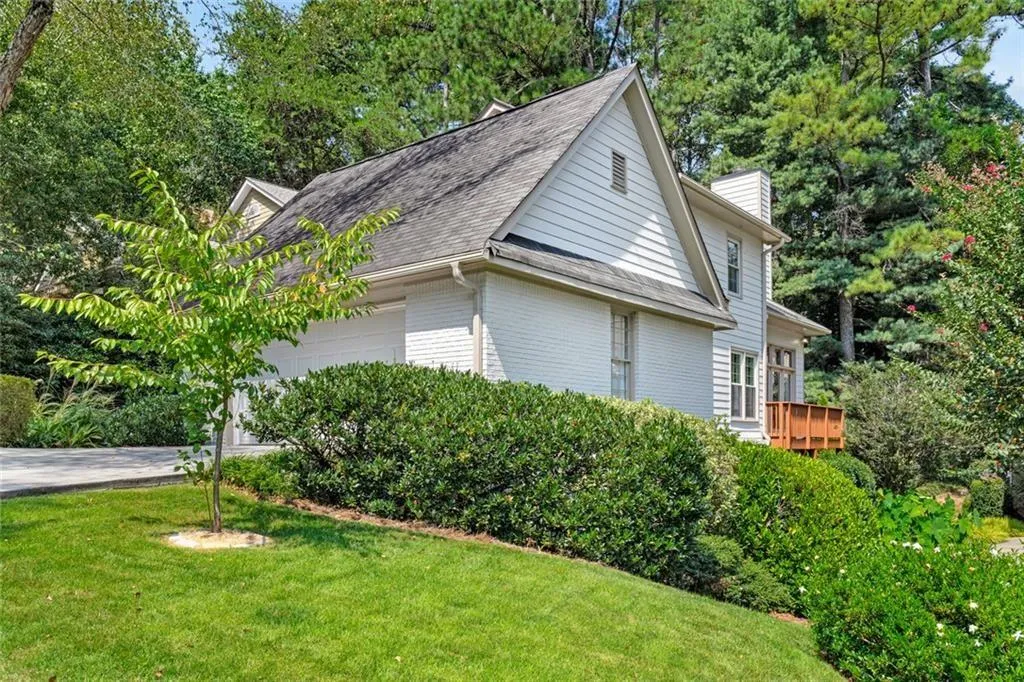 Recently painted exterior and trim. The deck on the side of home wraps around to the rear yard area.