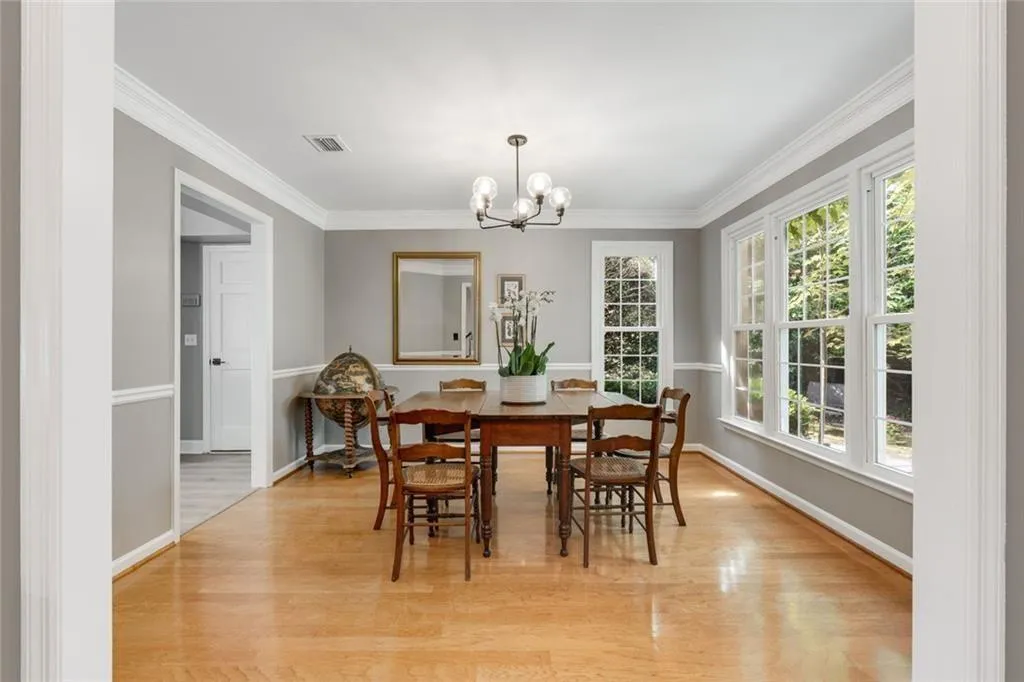 Gracious Dining Room is flooded with natural light from large, oversized windows.