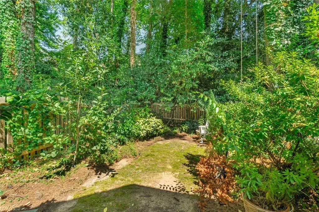 Fenced backyard with recent fencing!