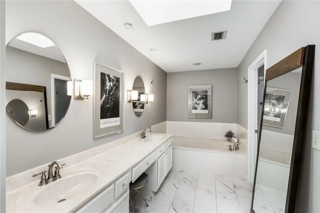 Double vanity with great storage. New tiled flooring and lighting fistures too!