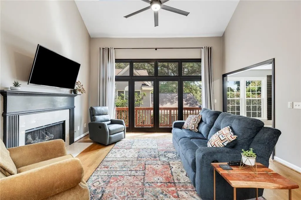 Hardwood floors throughout living areas. Atrium doors open to the deck.