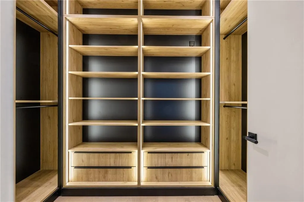 Every bedroom features custom LED-lit closets with exceptional craftsmanship — the builder spared no expense in creating a seamless blend of luxury, style, and functionality throughout. Every bedroom features custom LED-lit closets with exceptional craftsmanship — the builder spared no expense in creating a seamless blend of luxury, style, and functionality throughout.
