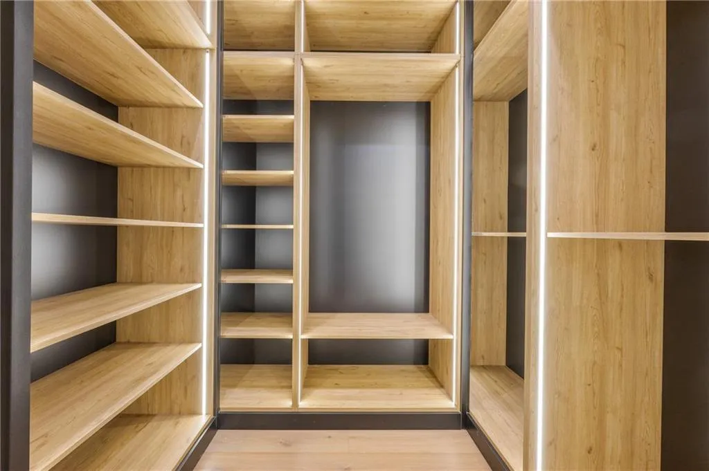 Every bedroom features custom LED-lit closets with exceptional craftsmanship — the builder spared no expense in creating a seamless blend of luxury, style, and functionality throughout. Every bedroom features custom LED-lit closets with exceptional craftsmanship — the builder spared no expense in creating a seamless blend of luxury, style, and functionality throughout.