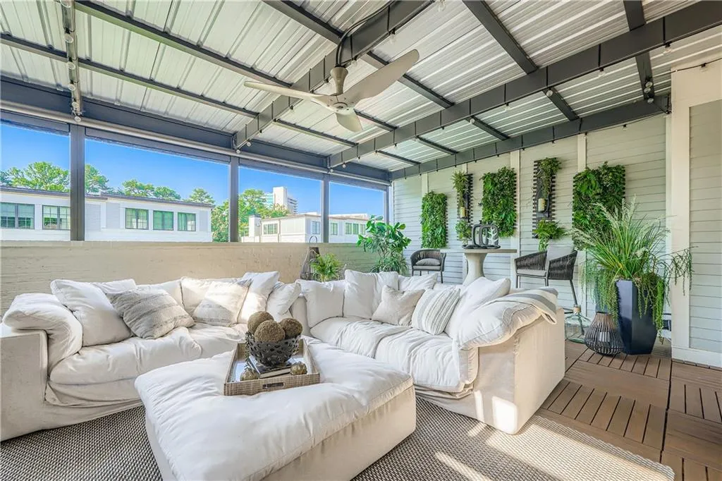 Rooftop deck with fireplace and tv.