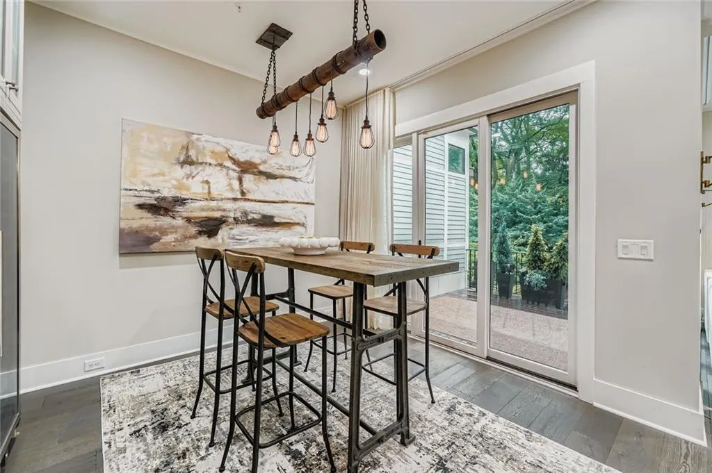 Dining space/wine room with hardwood / wood-style flooring