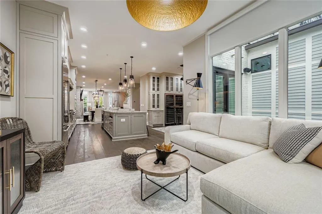 keeping room/sunroom with dark wood finished floors, recessed lighting, and beverage cooler