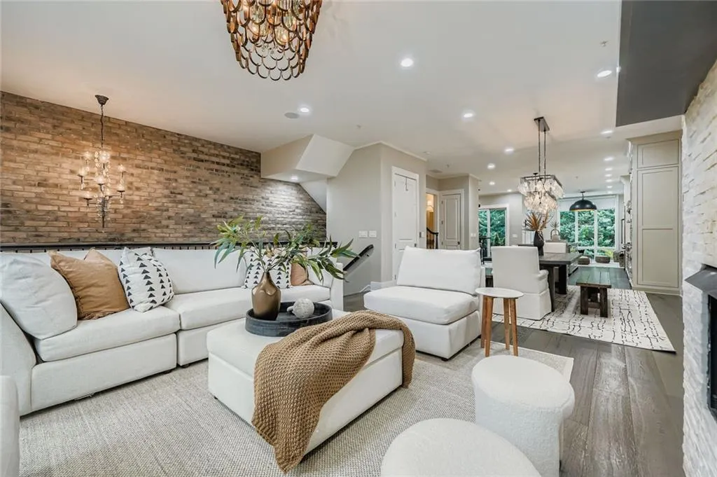 Kitchen with dark wood finished floors, an island with sink, open floor plan, wine cooler, and recessed lighting