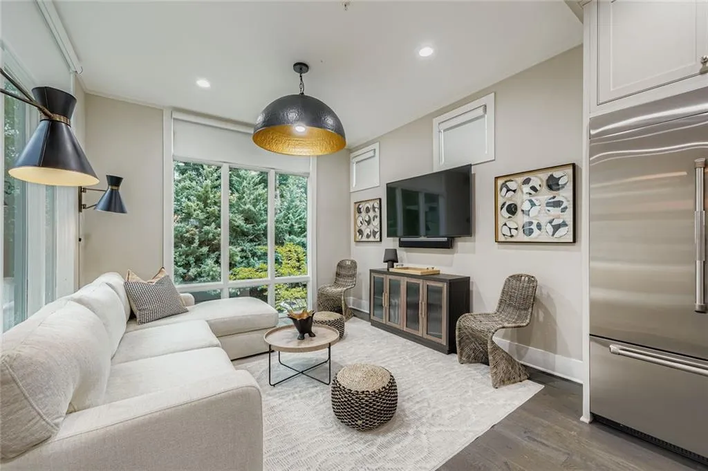 Keeping room/sunroom with wood finished floors, recessed lighting, and crown molding