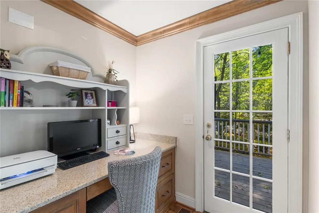 A dedicated office space on the main floor offers both privacy and abundant natural light, making it ideal for working from home.