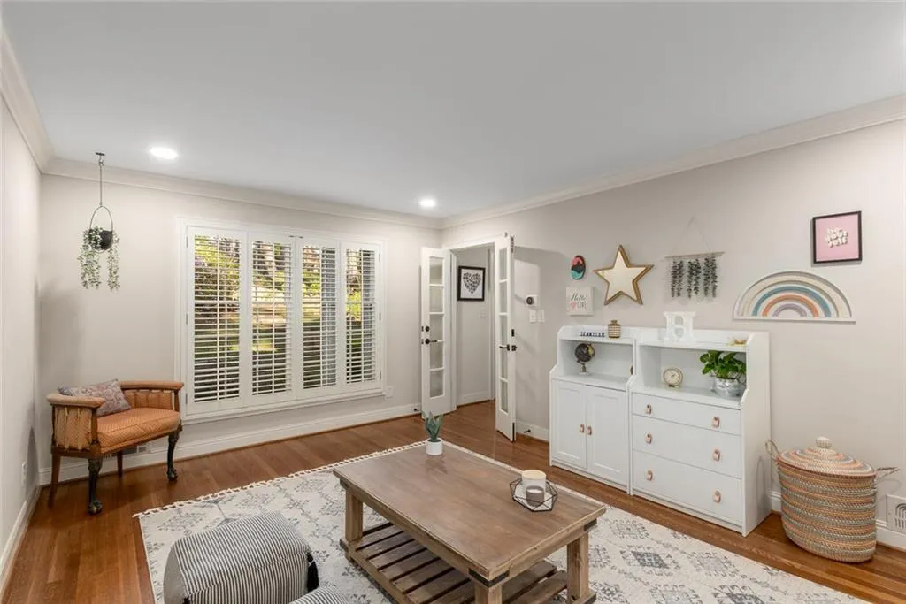 The formal living room is currently used as a flexible space, but it seamlessly connects to the main living area, making it easy to adapt to your needs