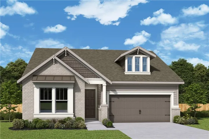 Brick and siding exterior with a shingle roof, integrated garage, and a gabled dormer