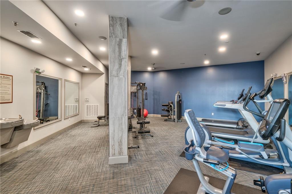 Workout area featuring dark carpet