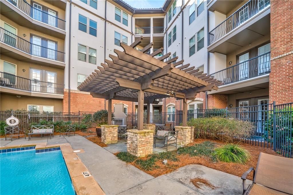 View of pool featuring a pergola and a patio area