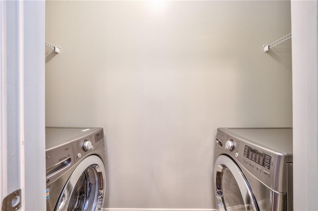 Laundry room featuring washer and clothes dryer