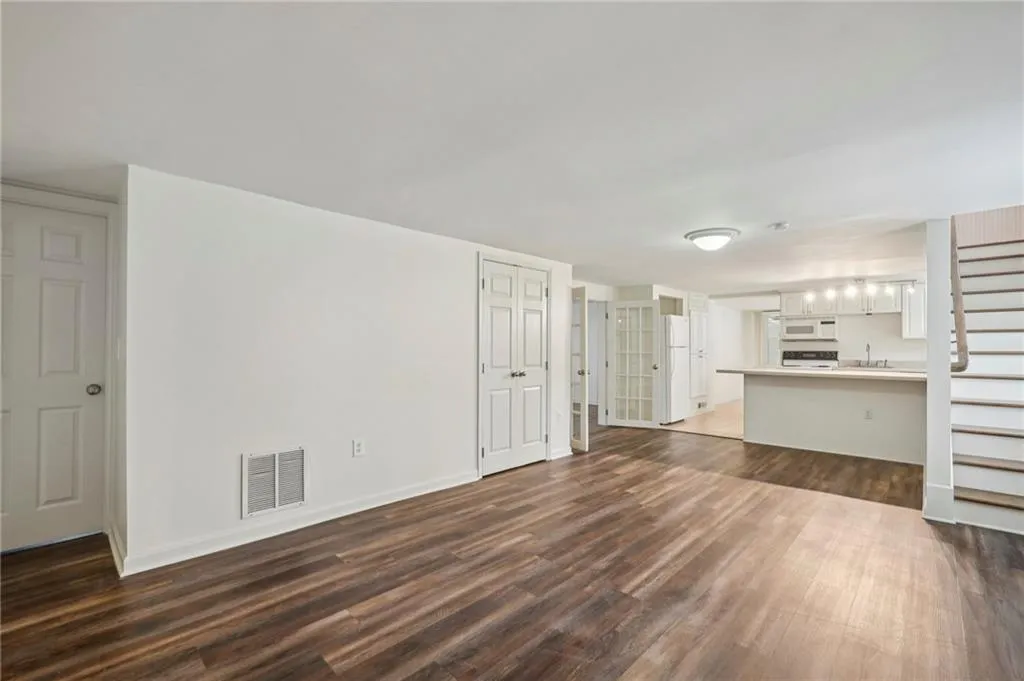 Lower Level Living room, play room, office, open to full kitchen