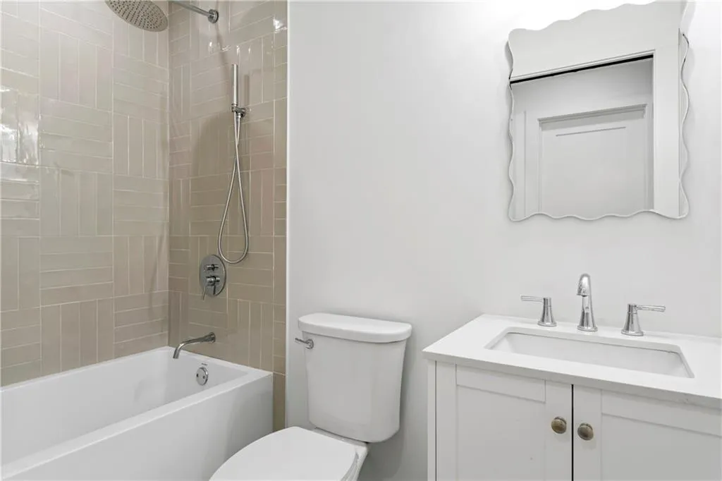 Full bath featuring vanity and bathtub / shower combination
