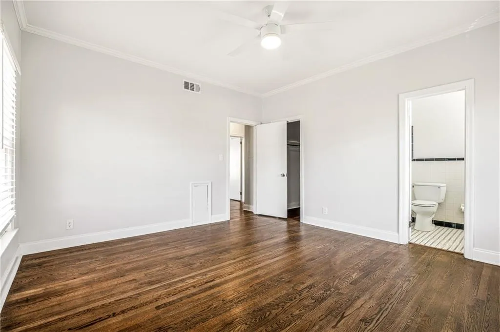Bedroom with private bath and walk in closet.