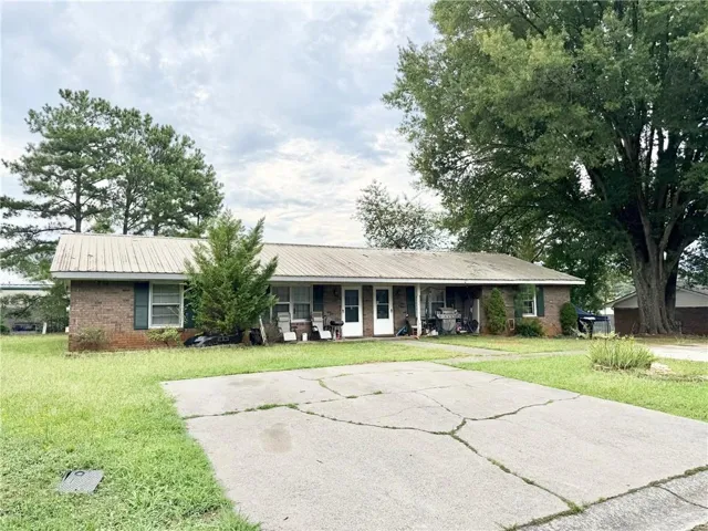 Brick facade structure with a metal roof