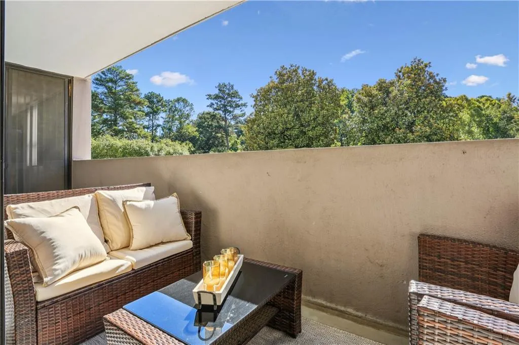 Balcony with an outdoor living space with a fire pit