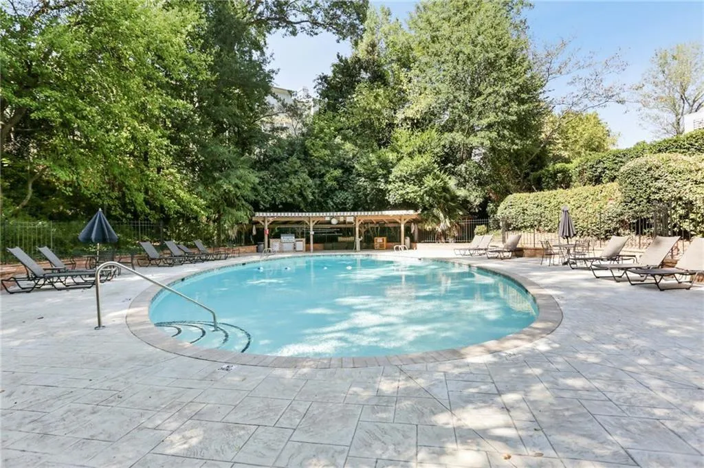 Community Pool that offers plenty of lounge chairs and grills for cooking outdoors
