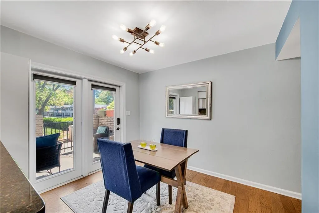 Dining room featuring light hardwood / wood-style floors and an inviting chandelier