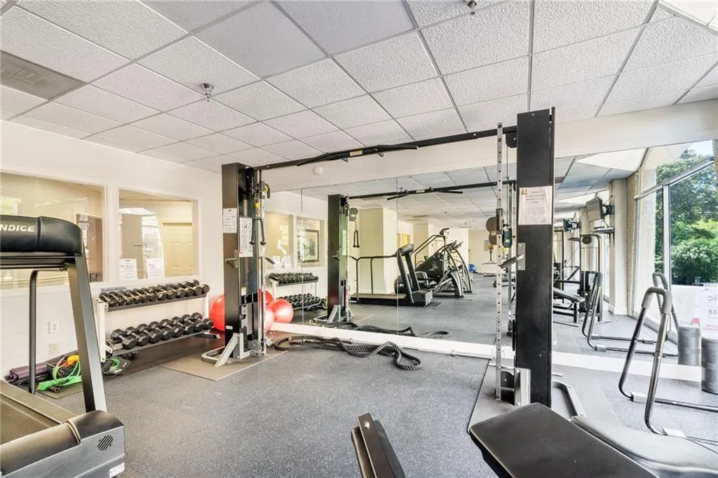 Gym with a paneled ceiling