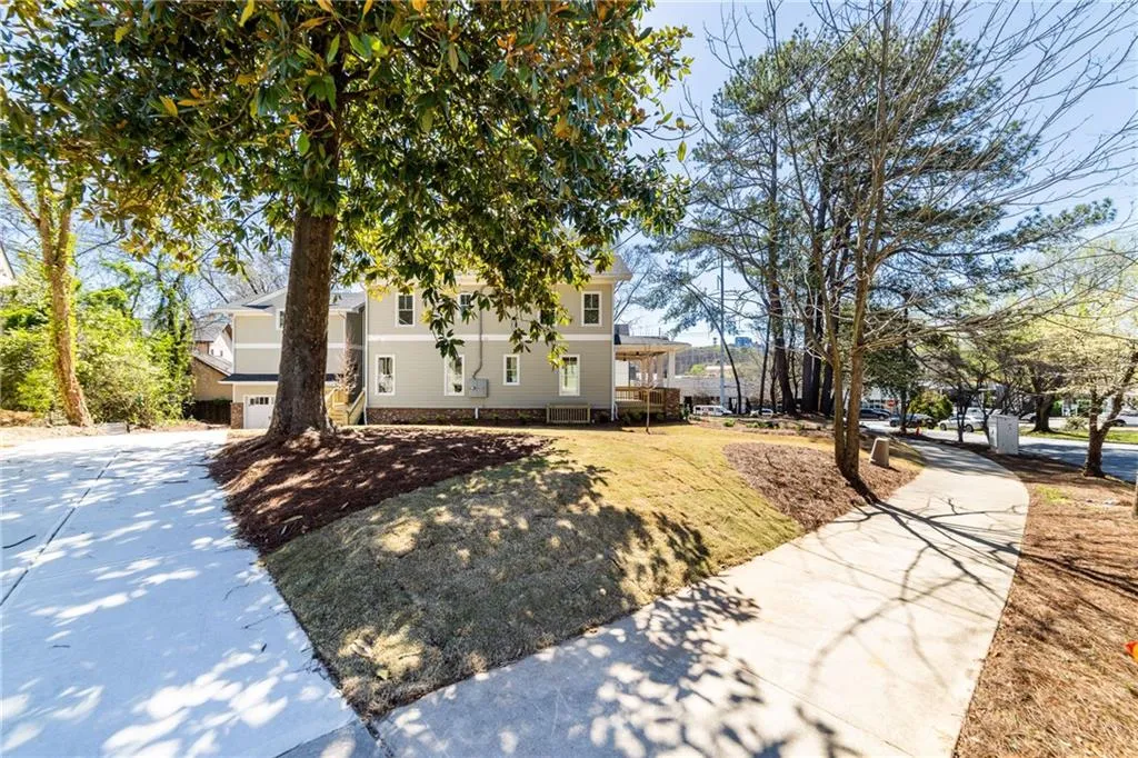 View of front of house with a garage and concrete driveway