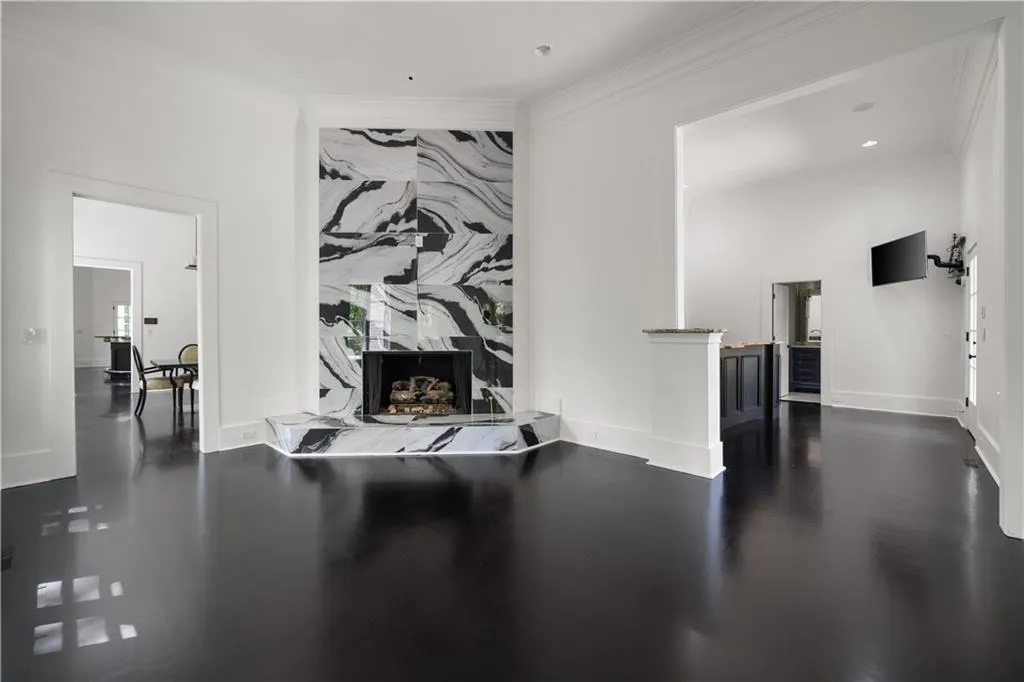 Workout room with ornamental molding and dark wood finished floors