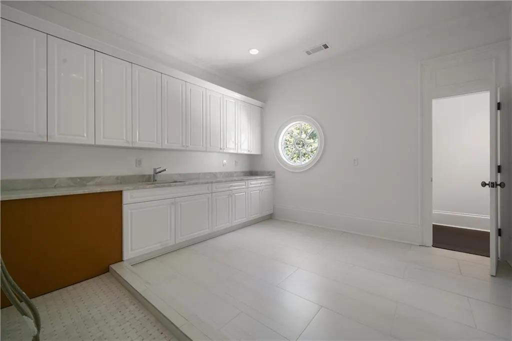 Bathroom with vanity and a shower stall