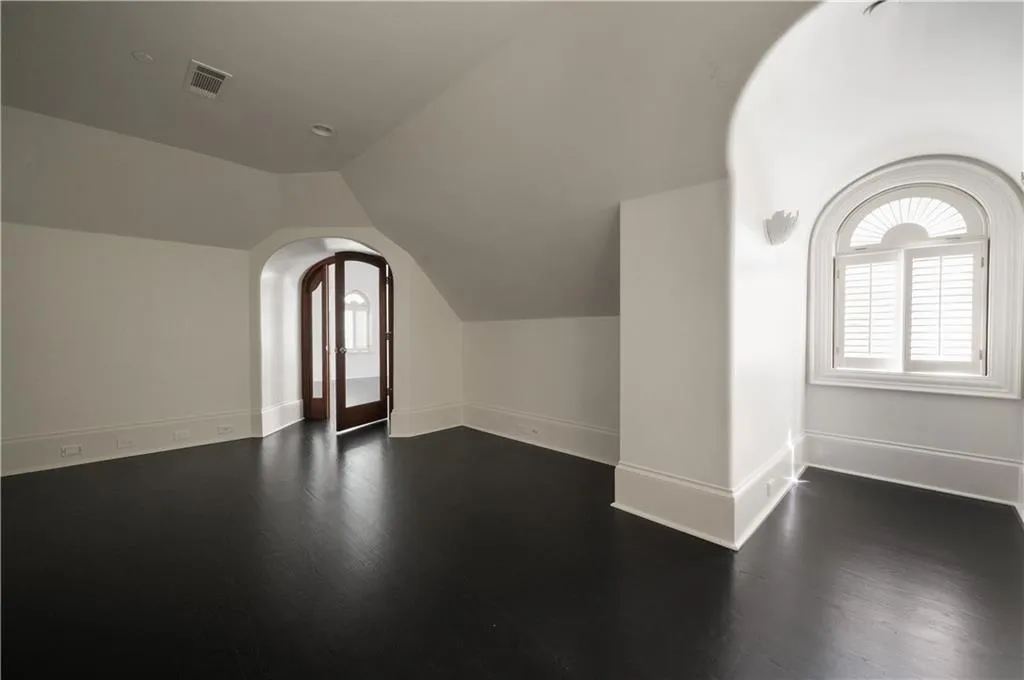 Unfurnished living room with ornamental molding and a tile fireplace