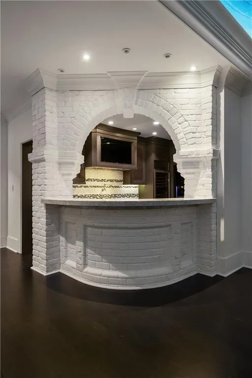 Reception area with crown molding and recessed lighting