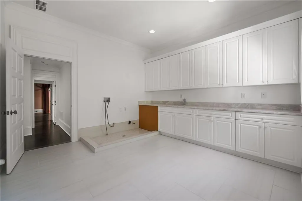 Bathroom featuring vanity and lofted ceiling