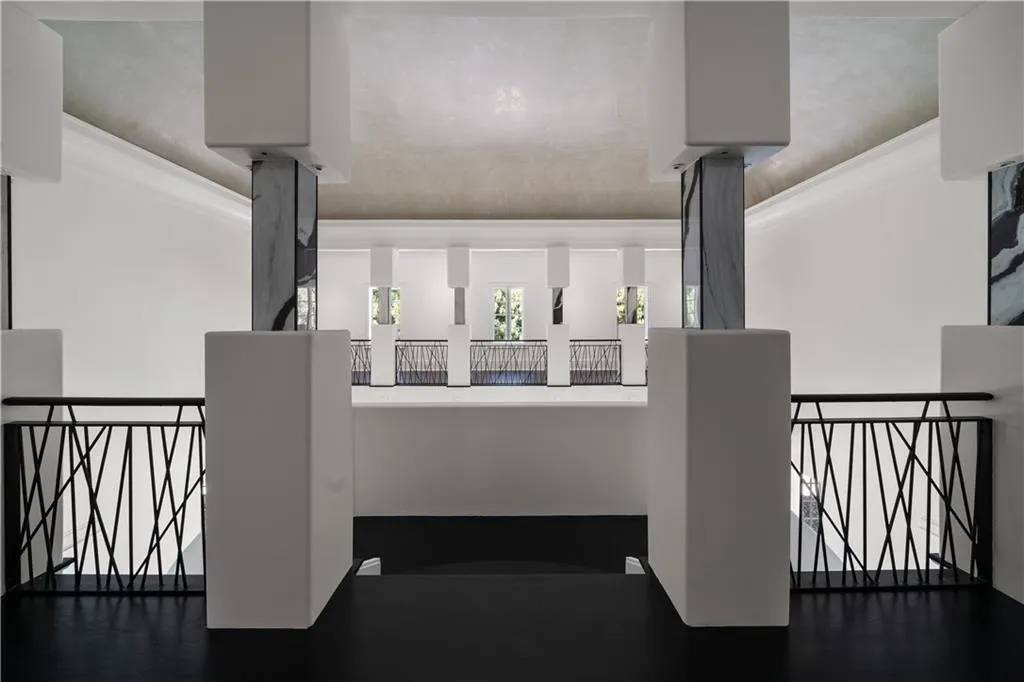 Stairs featuring ornamental molding and wood finished floors