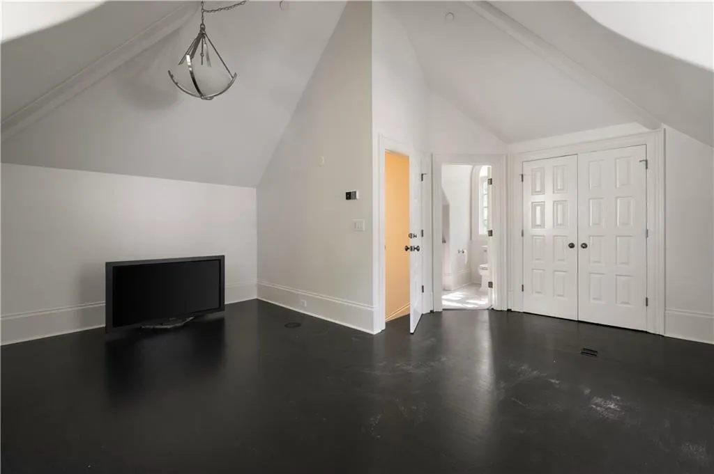Bathroom with vanity, light wood-style flooring, a wainscoted wall, an enclosed shower, and wooden walls