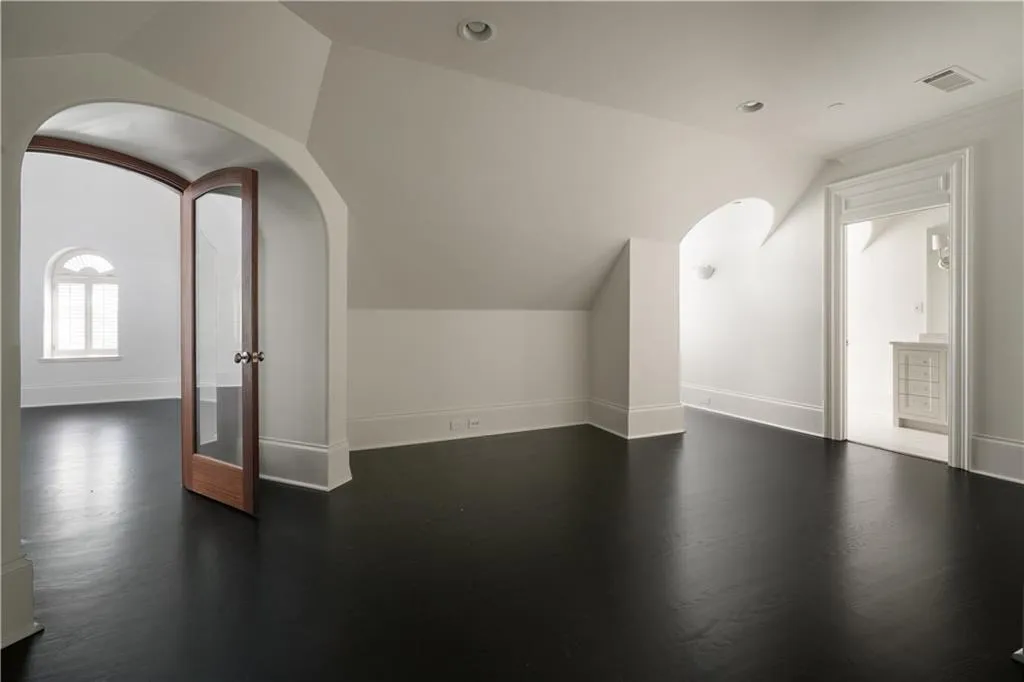 Unfurnished living room featuring ornamental molding and a fireplace