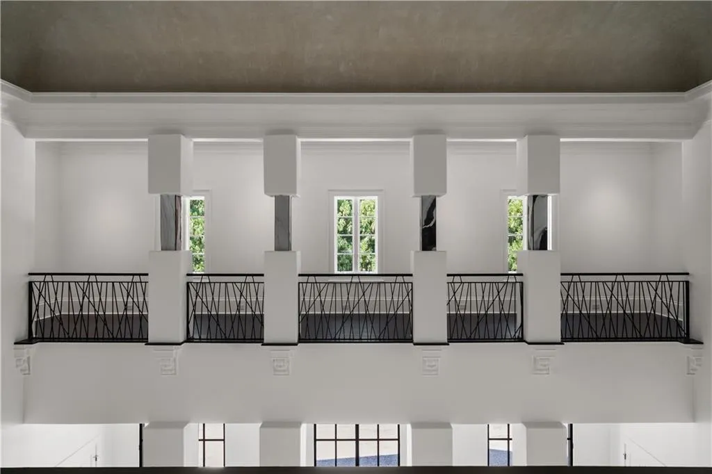 Empty room featuring a high ceiling