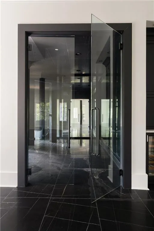 Additional living space featuring lofted ceiling and dark wood finished floors