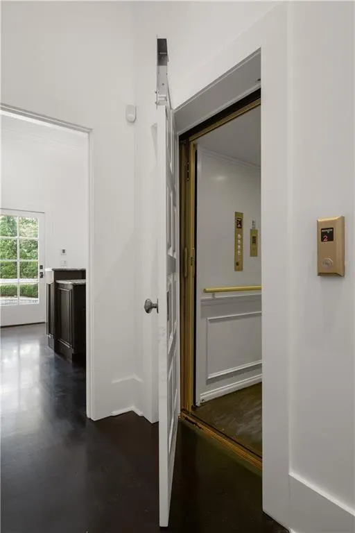 Hallway featuring dark wood finished floors