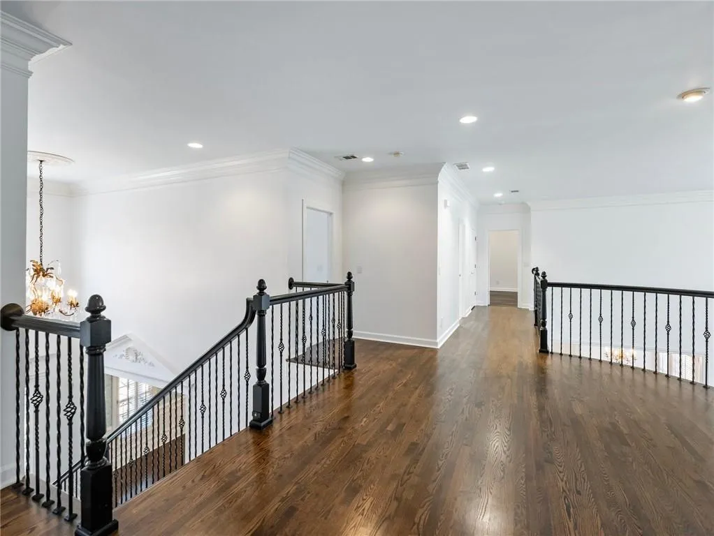 Upstairs landing area is spacious and overlooks great room.