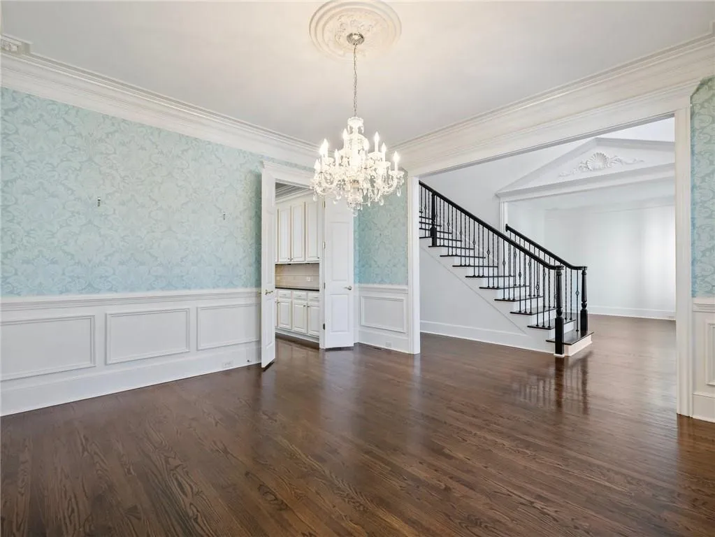 Dining room leading to kitchen and foyer.