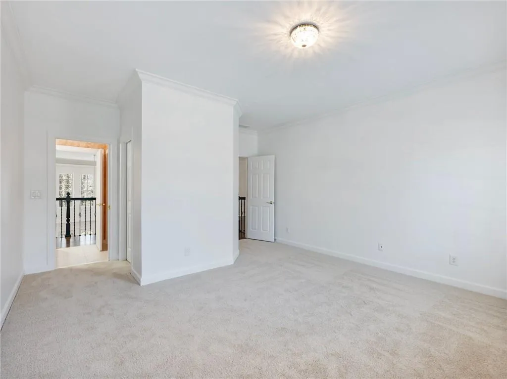 Bedroom leading to hallway above great room.